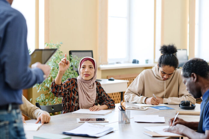 Woman Asking Teacher Question