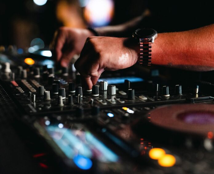 a dj playing music in a nightclub