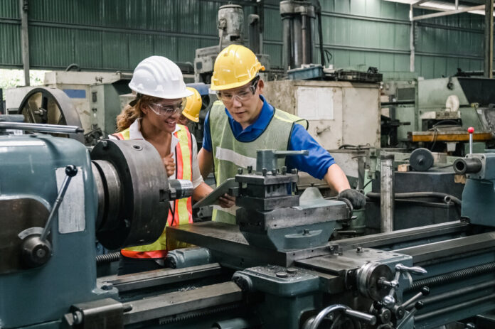 Teamwork professional engineer working heavy industry in factory.