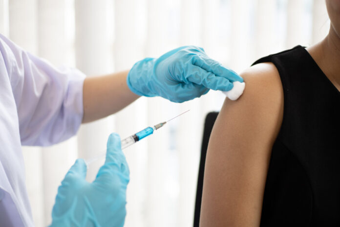 Doctor vaccinated against new strains of the virus for the patie